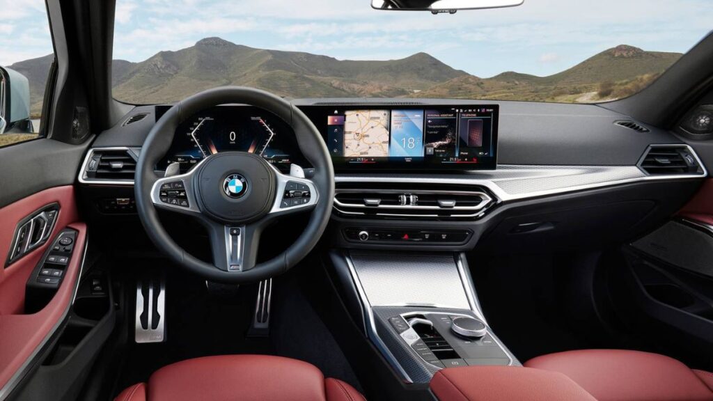 2022 BMW 3 Series interior showing the curved infotainment display and steering wheel