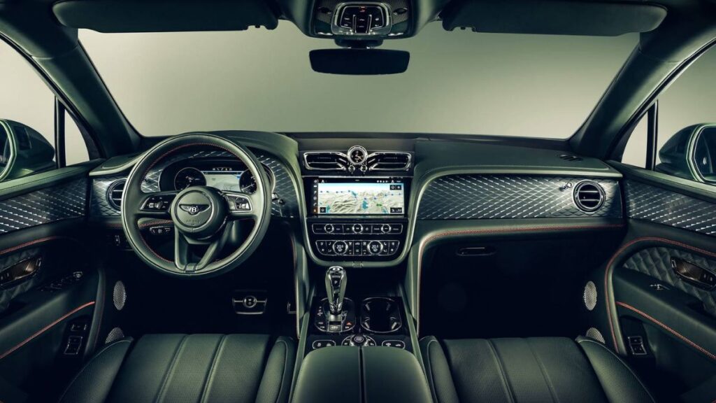 2023 Bentley Bentayga luxury interior, premium leather, genuine wood trim, and center infotainment screen.
