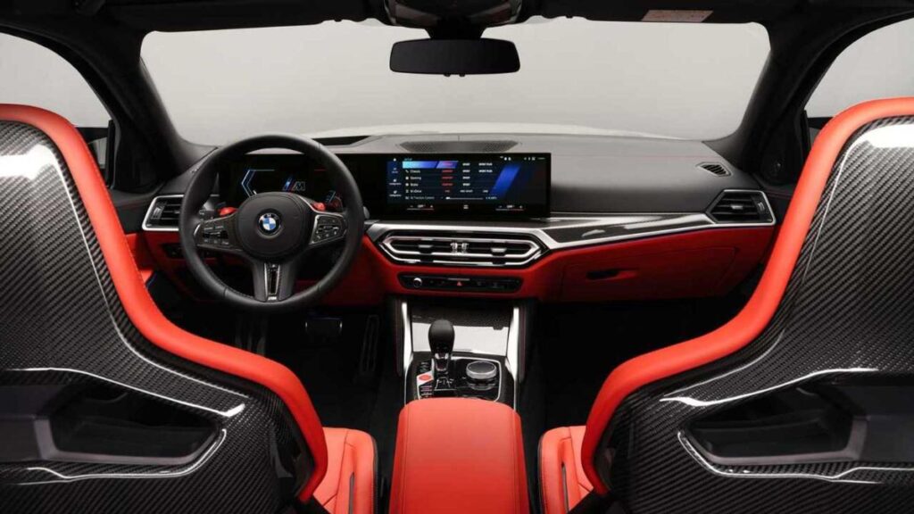 2023 BMW M3 Touring interior, curved display and M Sport seats.