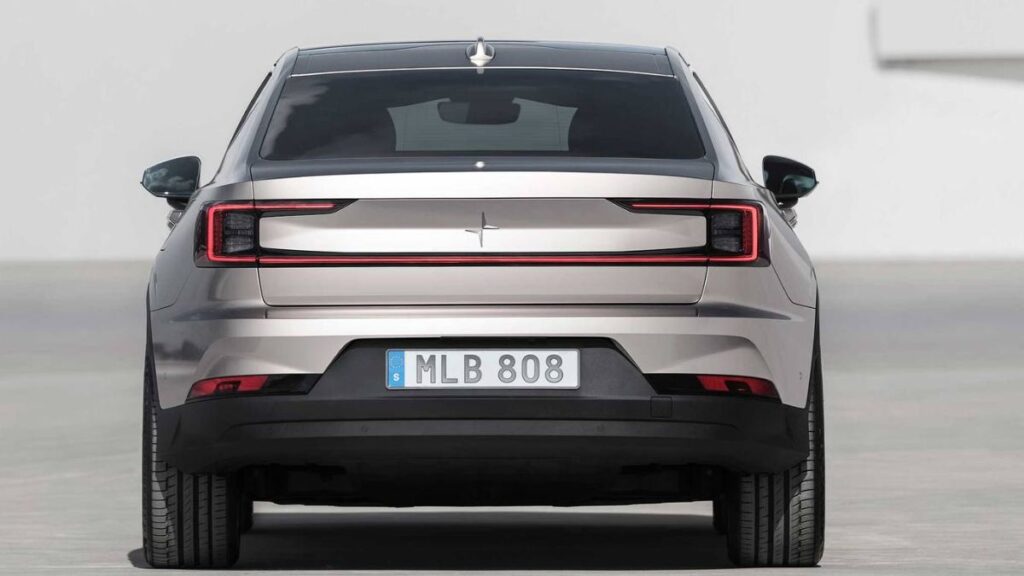 2024 Polestar 2 rear view, full-width LED light bar and clean hatchback tail.