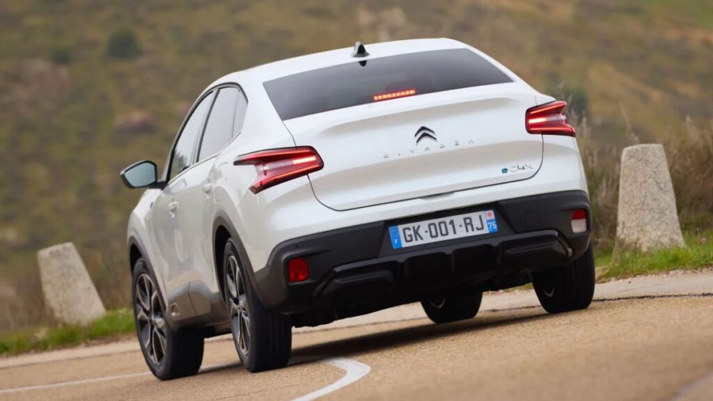 2023 Citroen e-C4 X rear view, sloping roofline and LED taillights.