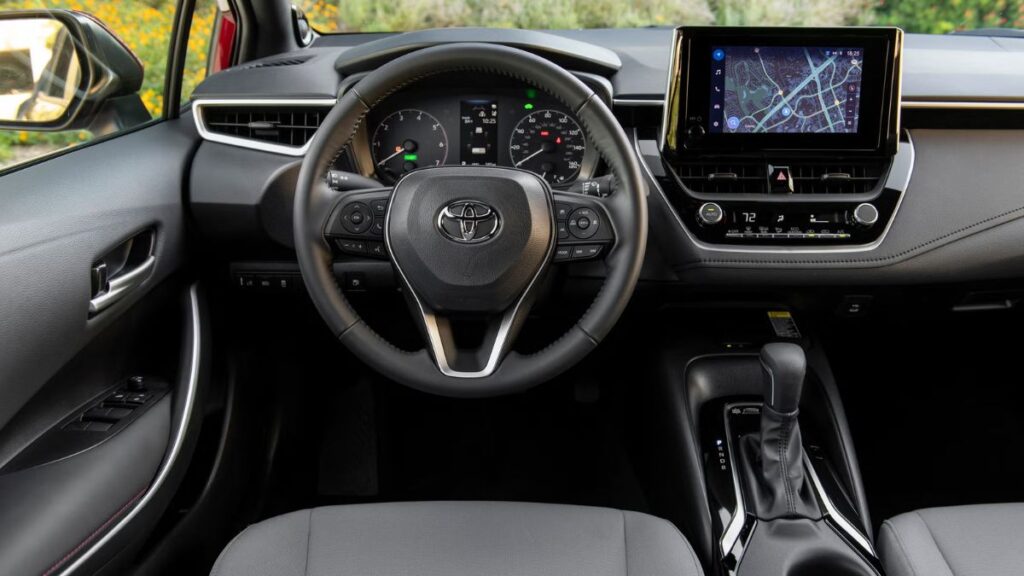 Interior dashboard and cabin of the 2023 Toyota Corolla SX Hybrid showing infotainment system