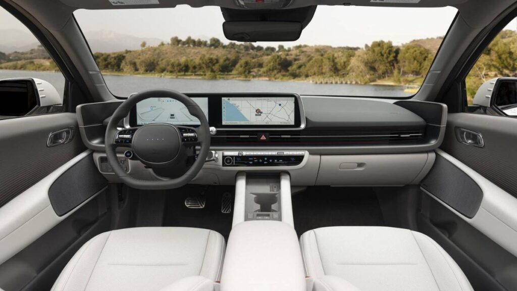 2023 Hyundai Ioniq 6 interior, dual-curved screens and ambient lighting.
