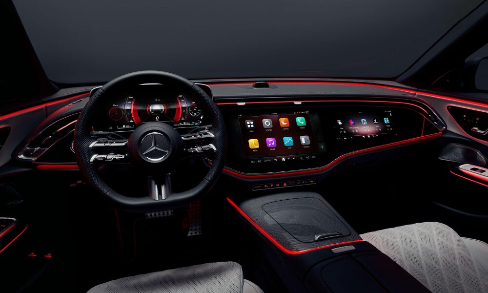 2023 Mercedes-Benz E-Class interior featuring dual digital displays, ambient lighting, and premium luxury materials