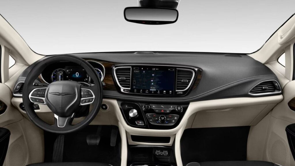 2023 Chrysler Pacifica minivan interior showing dashboard, Uconnect touchscreen, seating, and premium cabin features