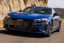 2022 Audi e-tron GT Sedan front view showcasing sleek headlights, aerodynamic design, and sporty electric styling