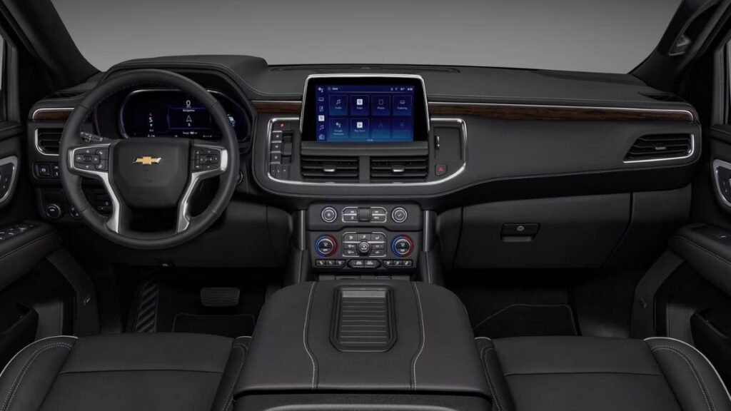 2023 Chevrolet Tahoe interior showing three rows of seating for up to eight passengers, leather upholstery, 10.2-inch touchscreen display, and spacious luxury cabin