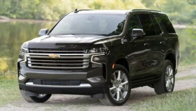 2023 Chevrolet Tahoe front view showing bold vertical grille, dual LED headlights, and aggressive front end design of full-size three-row SUV