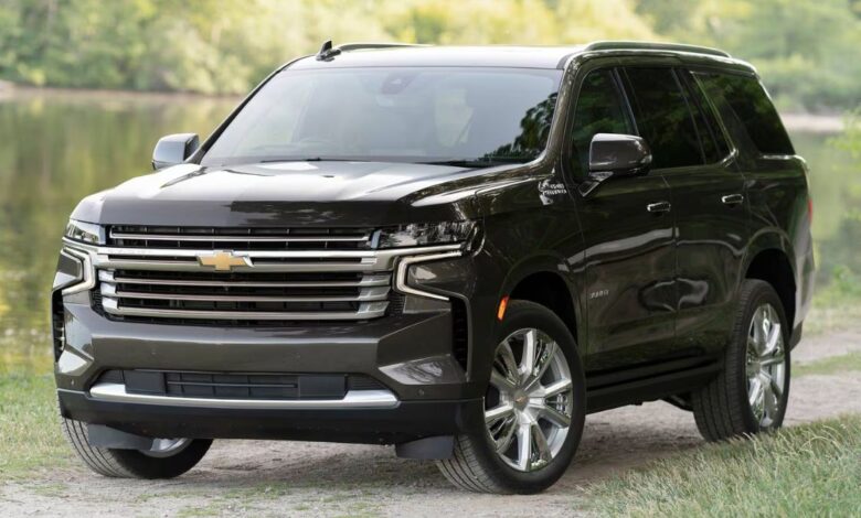 2023 Chevrolet Tahoe front view showing bold vertical grille, dual LED headlights, and aggressive front end design of full-size three-row SUV