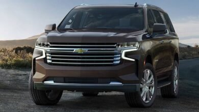 2023 Chevrolet Suburban front view showing bold vertical signature grille, dual LED headlights, and commanding front end of extended-length full-size SUV