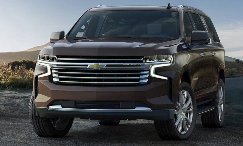 2023 Chevrolet Suburban front view showing bold vertical signature grille, dual LED headlights, and commanding front end of extended-length full-size SUV