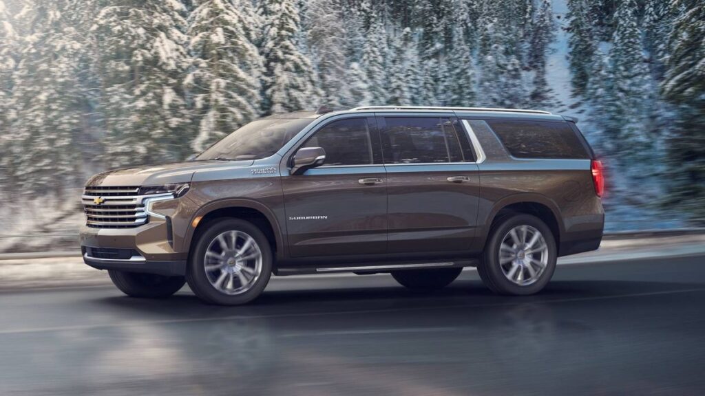 2023 Chevrolet Suburban side profile showing extended wheelbase full-size configuration, three rows of seating, generous body lines, and 20-inch or 22-inch alloy wheels