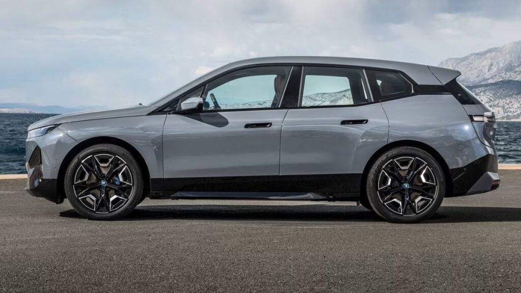 2023 BMW iX side profile highlighting aerodynamic styling and luxury SUV proportions