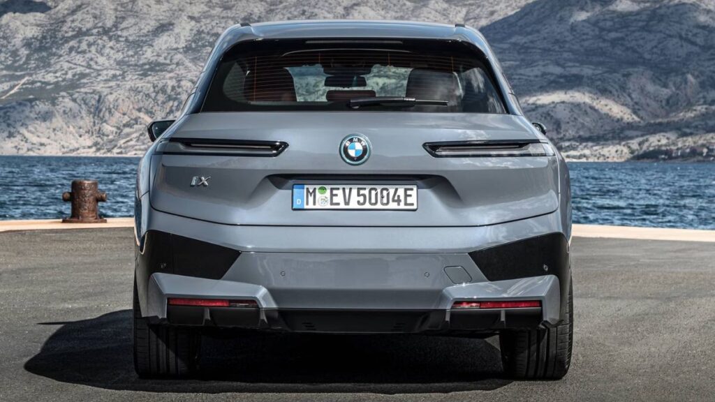 2023 BMW iX rear view with slim LED taillights and modern electric SUV styling