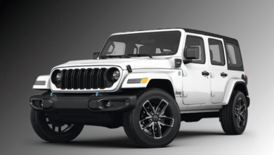 2024 Jeep Wrangler High Altitude 4xe front view, body-color grille and LED headlights.