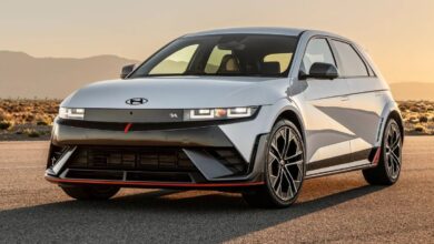 2025 Hyundai Ioniq 5 N front view, aggressive N mask grille and lower stance.