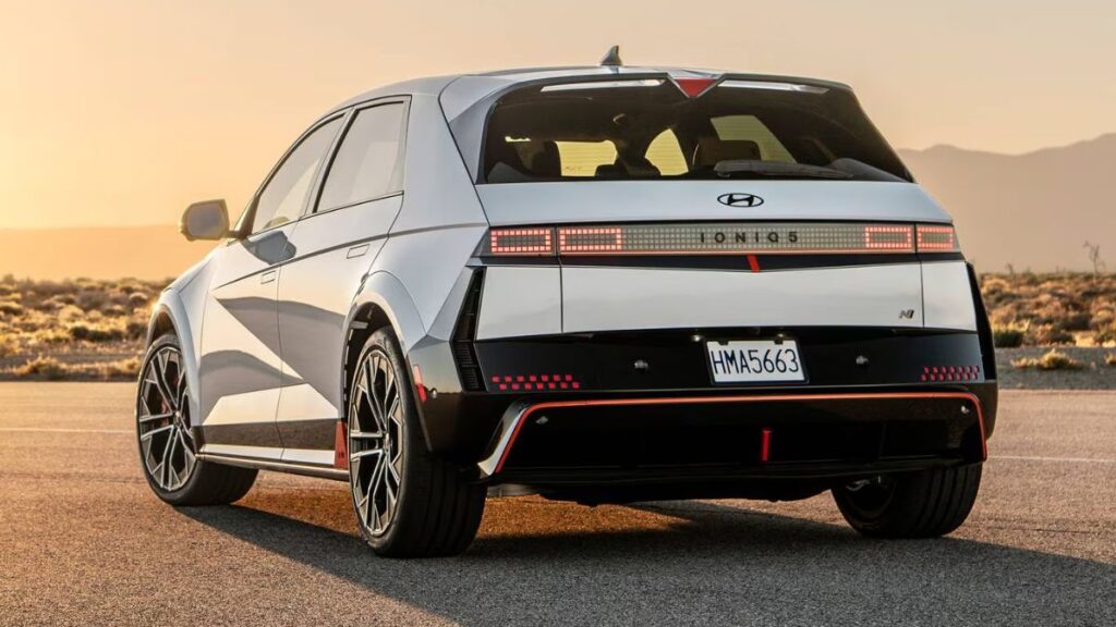 2025 Hyundai Ioniq 5 N rear view, wing-type spoiler and full-width pixel taillights.