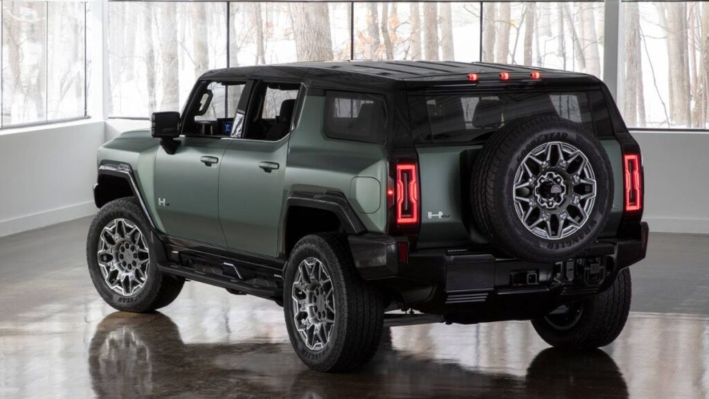 2024 GMC Hummer EV SUV rear view, LED taillights and spare tire.