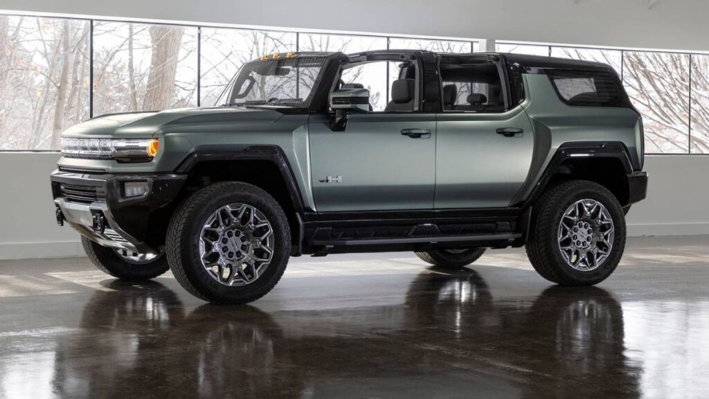 2024 GMC Hummer EV SUV side profile, boxy silhouette and large wheels.
