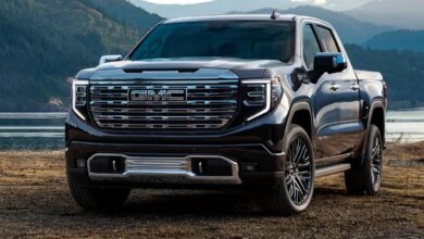 2023 GMC Sierra 1500 front view, imposing grille and C-shaped LED headlamps.