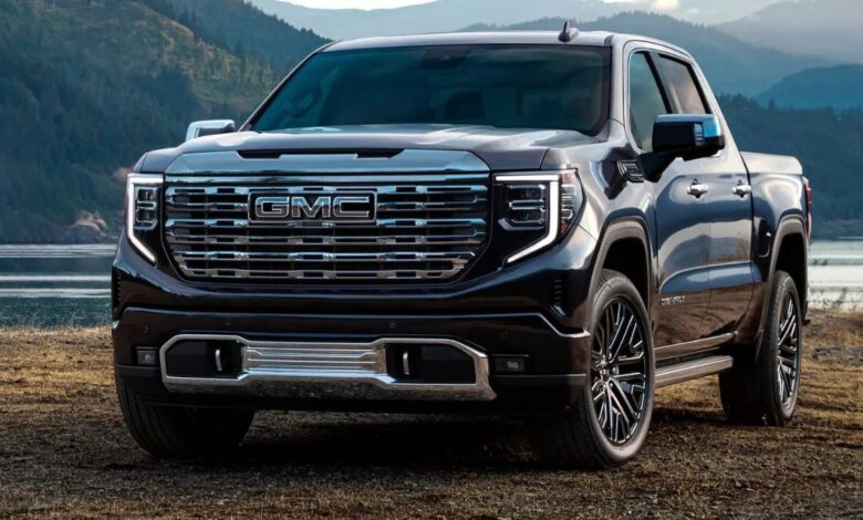 2023 GMC Sierra 1500 front view, imposing grille and C-shaped LED headlamps.