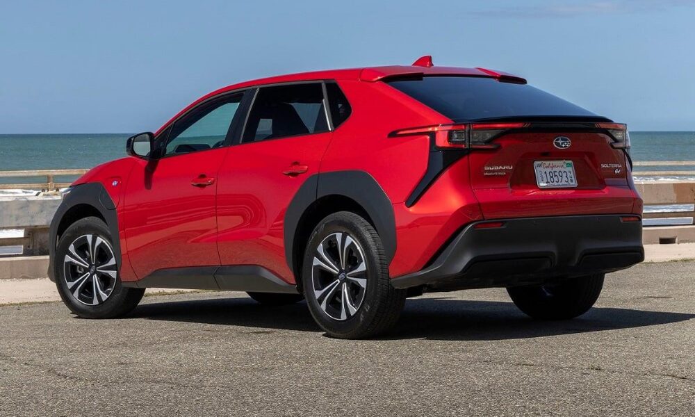 2023 Subaru Solterra side profile in red highlighting aerodynamic design and electric SUV proportions