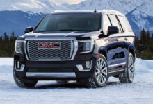 2022 GMC Yukon front view showcasing grille, headlights, and bold SUV design