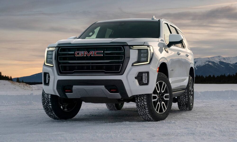 2022 GMC Yukon front view showcasing grille, headlights, and bold SUV design
