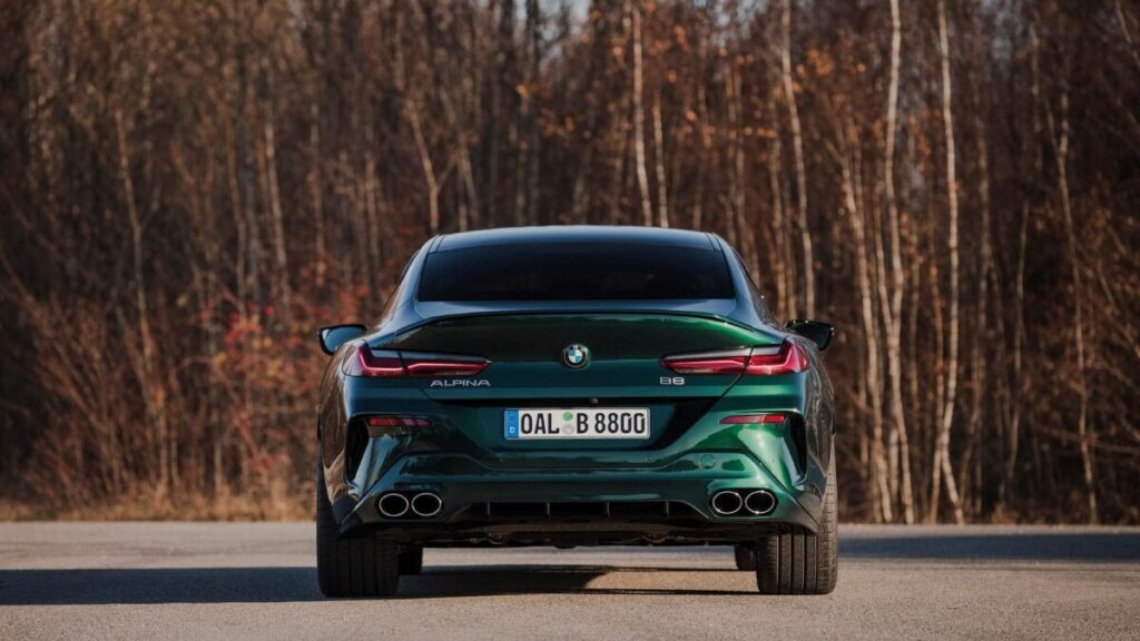 Rear view of the 2023 BMW Alpina B8 Gran Coupe showing quad exhaust outlets and LED taillights
