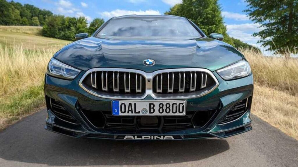 Front view of the 2023 BMW Alpina B8 Gran Coupe parked on a scenic mountain road