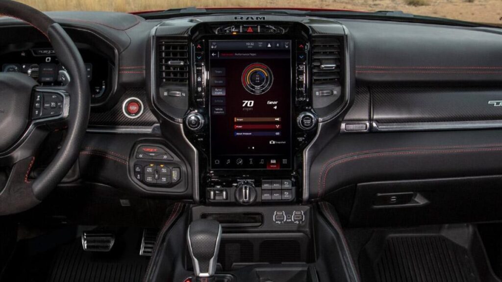 2022 Ram 1500 TRX blasting through desert sand during high-speed off-road driving