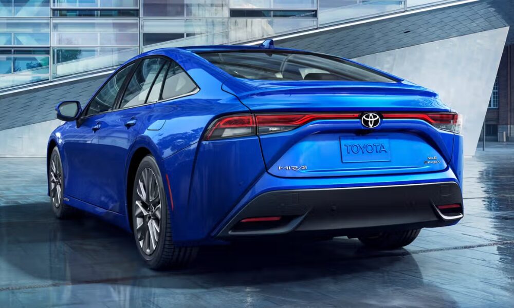 Rear angle of the 2025 Toyota Mirai showing taillights and hydrogen details.