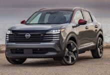 2025 Nissan Kicks front view showing bold grille and modern LED headlights