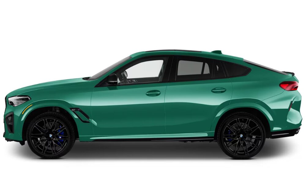 2026 BMW X6 M side view featuring coupe-style roofline and sporty SUV silhouette.