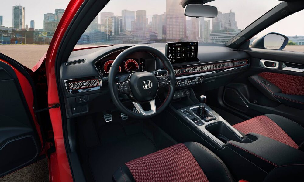 Interior of the 2026 Honda Civic Sedan showing the dashboard, touchscreen and premium cabin layout.