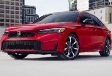 Front view of the 2026 Honda Civic Sedan showcasing the updated grille and LED headlights.