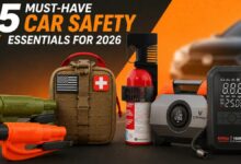 5 Must-Have Car Safety Essentials for 2026 featuring emergency escape tools, trauma kit, fire extinguisher, tire inflator, and portable jump starter