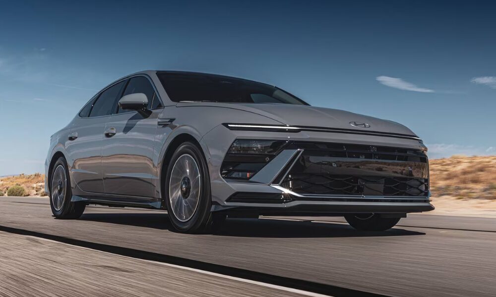 Front view of the 2025 Hyundai Sonata Hybrid driving on the road