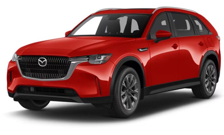 2026 Mazda CX-90 black SUV parked on a scenic road with mountains and sunset background