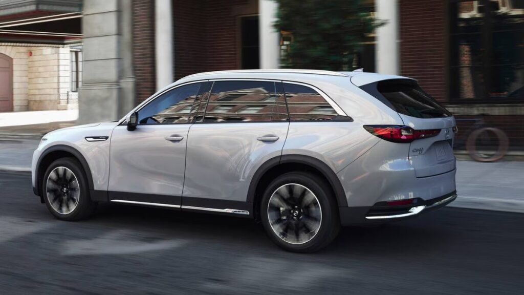 2026 Mazda CX-90 side profile black SUV with sleek body lines and large wheels