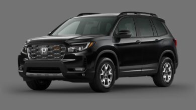 2023 Honda Passport front view parked outdoors showing rugged styling and V6-powered midsize SUV design