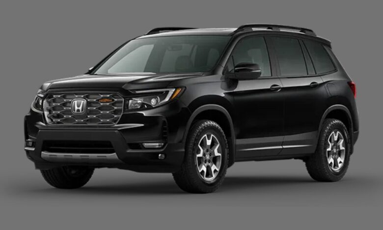 2023 Honda Passport front view parked outdoors showing rugged styling and V6-powered midsize SUV design