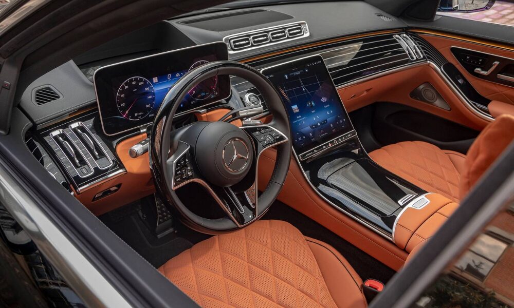 2023 Mercedes-Benz S-Class interior featuring luxury materials, ambient lighting, and MBUX infotainment