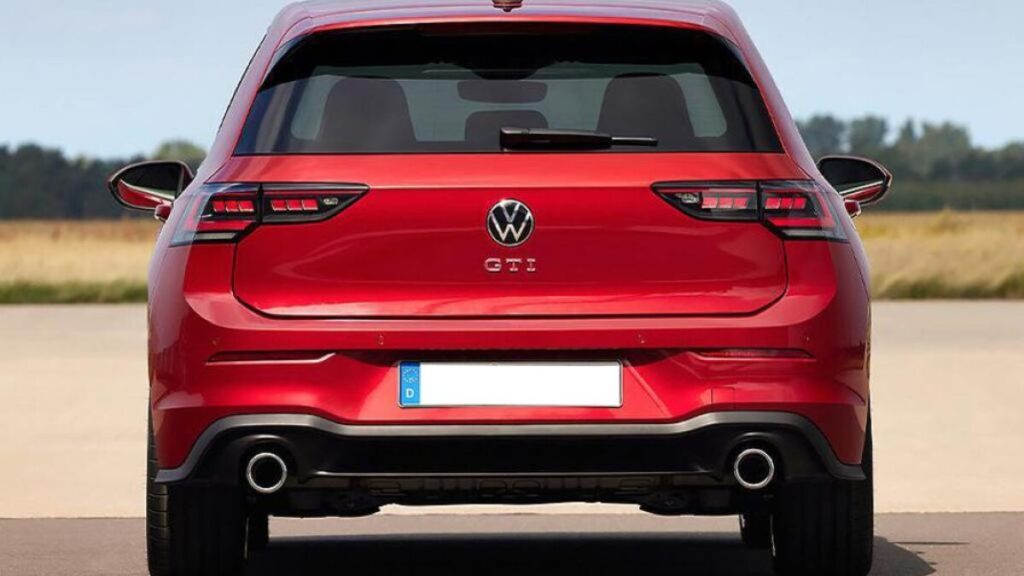 2025 Volkswagen Golf GTI rear view showcasing LED taillights, sporty bumper design, and dual exhaust outlets.