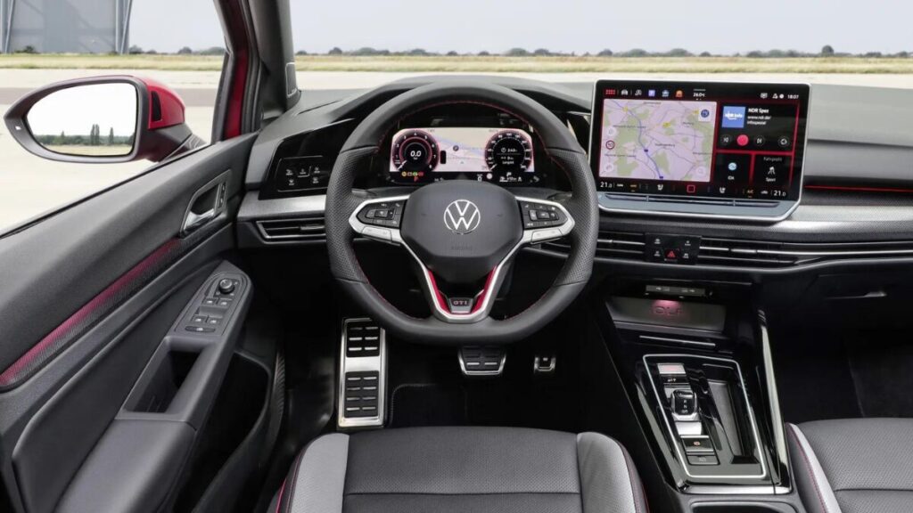 2025 Volkswagen Golf GTI interior featuring a 12.9-inch touchscreen, digital instrument cluster, and sport seats.