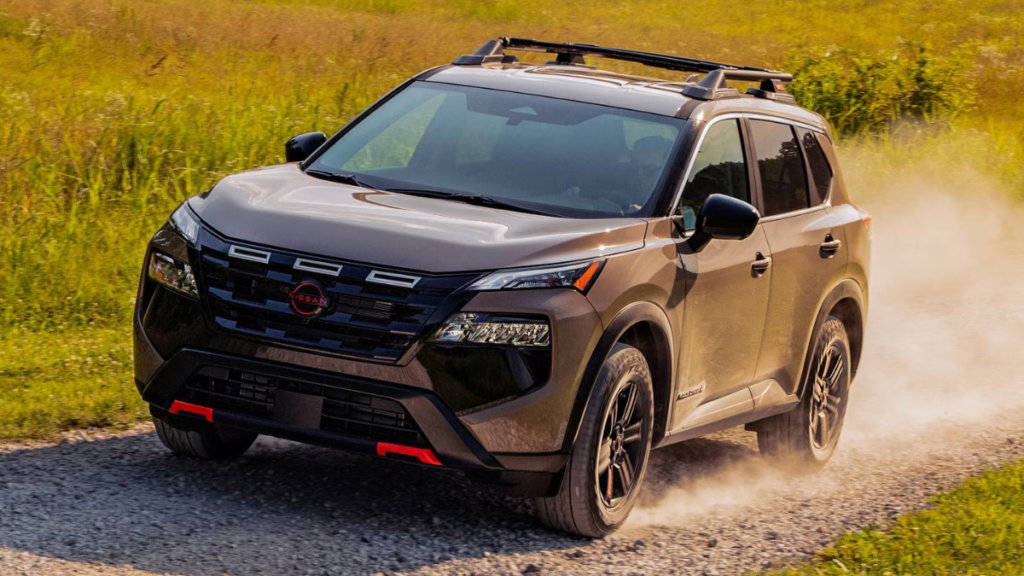 Compact SUV driving along a dirt road through a farm