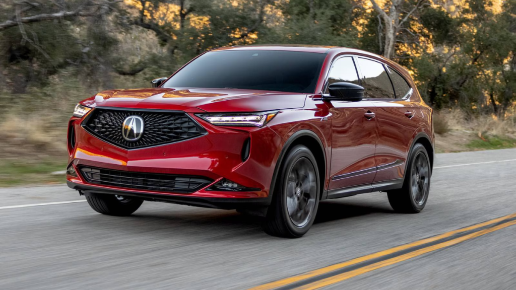 Luxury three row SUV driving on the road