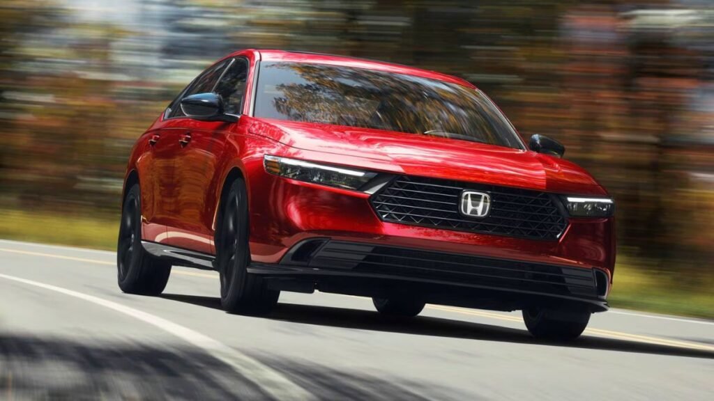 2026 Honda Accord driving on the road in a front three quarter view