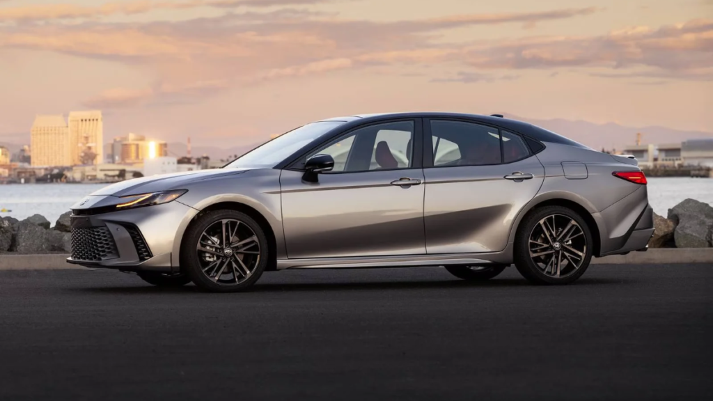 2026 Toyota Camry viewed from the side showing its sleek roofline and alloy wheels