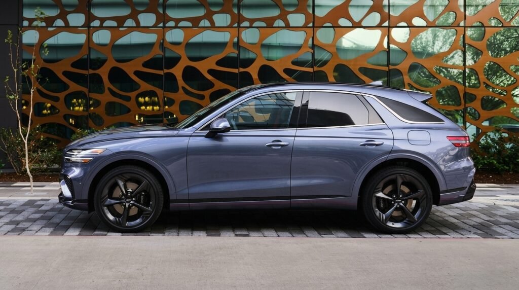 Side profile of the 2027 Genesis GV70 luxury compact SUV showing its sculpted body and sloping roofline